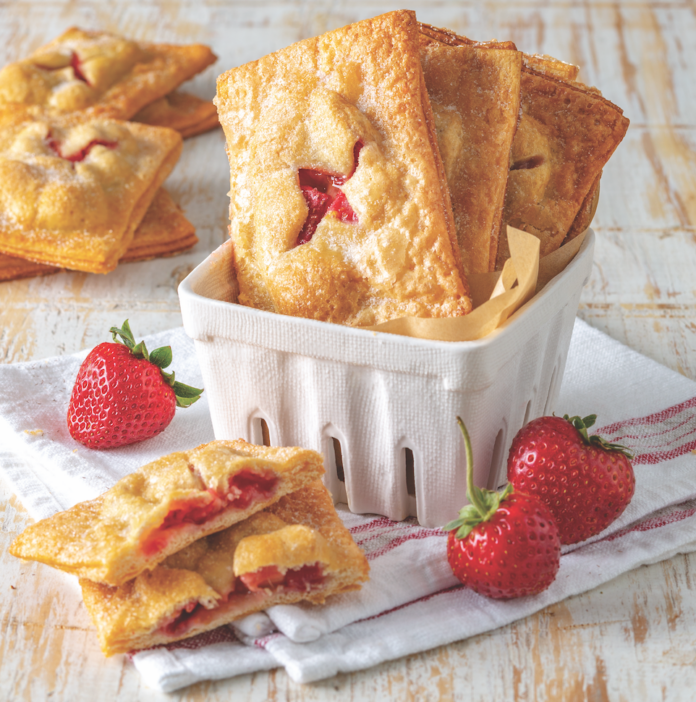 Remember those frozen fruit pastries that you popped in the toaster as a kid? You may be all grown up nowadays, but these buttery, flaky, tangy-sweet Strawberry-Rhubarb Hand Pies will please the young at heart.