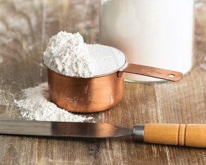 Measured flour with scraper