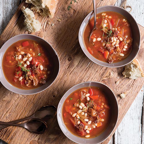 red soup in three bowls