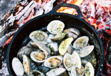 Chef’s Table: Whitney Otawka Whitney Otawka's woodfire Clams with fennel and lemon in a skillet on an open fire pit