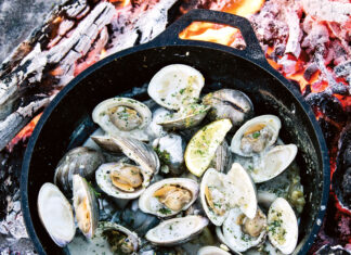 Chef’s Table: Whitney Otawka Whitney Otawka's woodfire Clams with fennel and lemon in a skillet on an open fire pit
