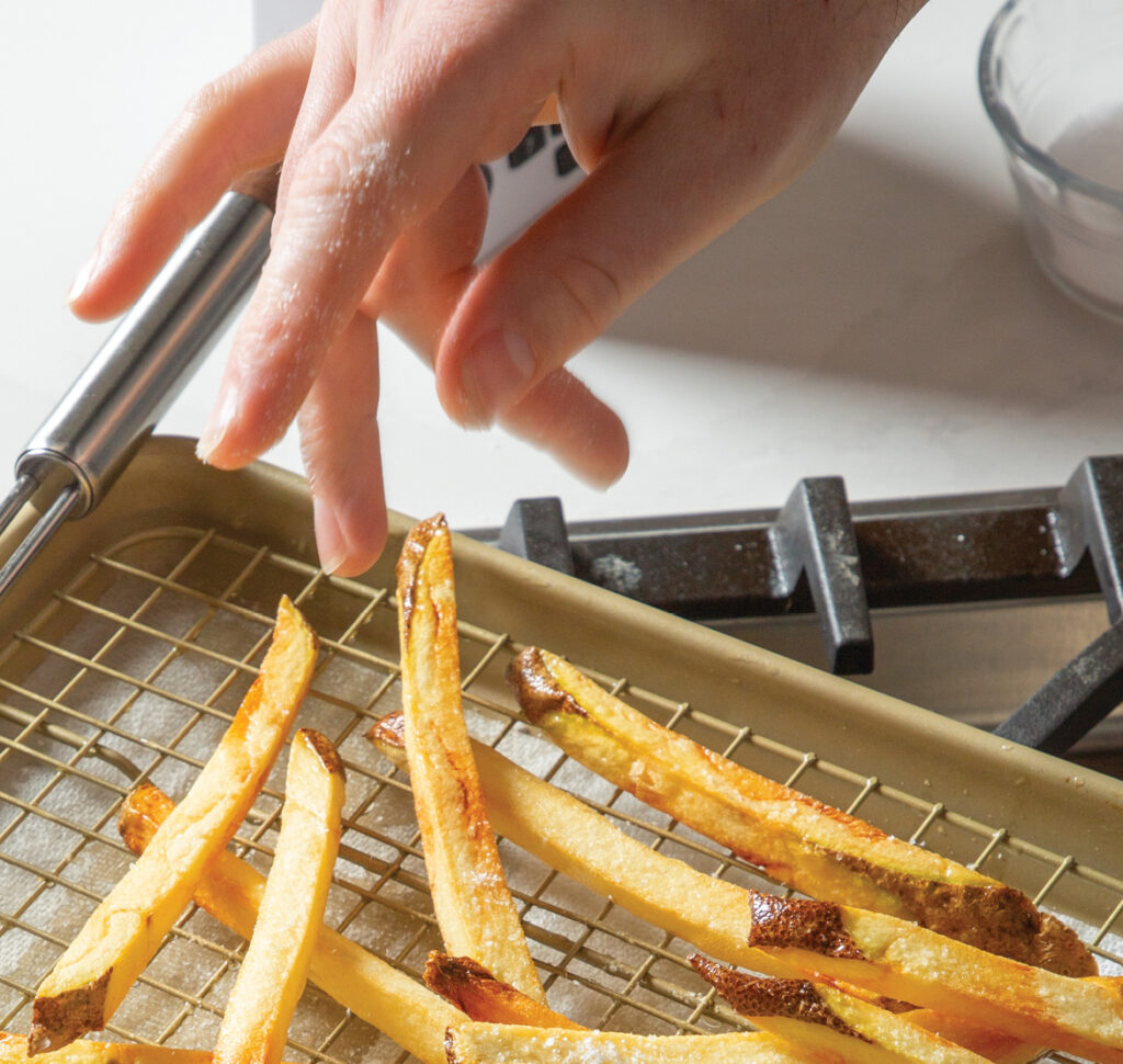 Step 7. Sprinkle the fries with kosher salt and desired seasonings; gently toss to combine.