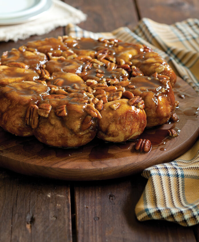 Upgrade your dessert game with this delightfully sticky-sweet Upside-Down Monkey Bread, featuring a delicious blend of pecans and cinnamon and baked to perfection in your cast-iron skillet.