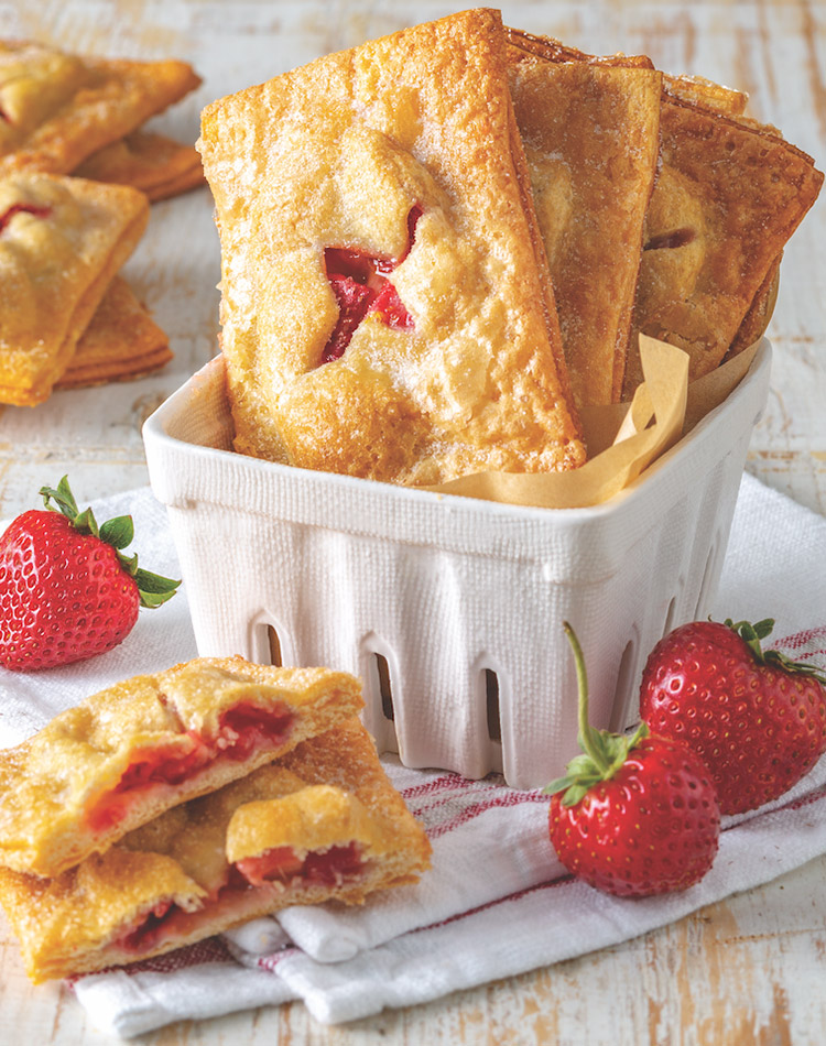 Remember those frozen fruit pastries that you popped in the toaster as a kid? You may be all grown up nowadays, but these buttery, flaky, tangy-sweet Strawberry-Rhubarb Hand Pies will please the young at heart.